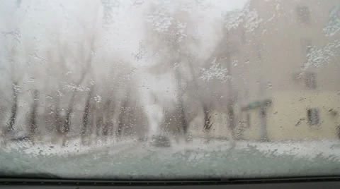 Melted snow flows over the windshield of the car Stock Footage 57511418