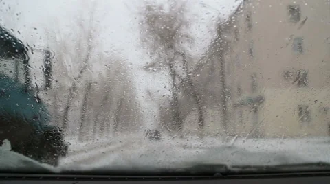 Melted snow flows over the windshield of the car, time-lapse Stock Footage 57511473