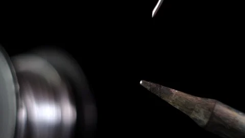 Melted solder wire over a hot soldering iron tip. Stock Footage 127626342