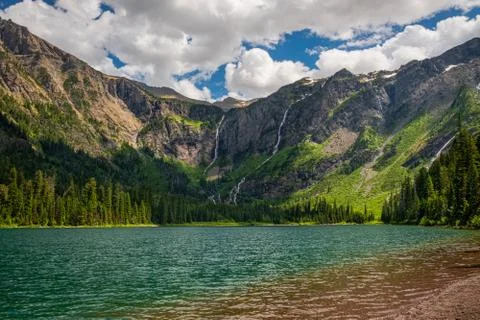 Melted sow streams down the mountains surrounding Avalanche Lake-GNP  Stock Photos
