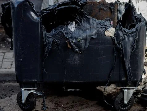 Melted trash can from fire Photos