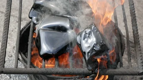 Melting bitumen by means fire for partial roof repair and fill cracks in roof Stock Footage 132082952