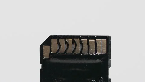 Melting black secure digital memory card. Video stock 148542033