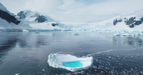Melting blue water iceberg float Antarctica ocean Stock Footage 274172137