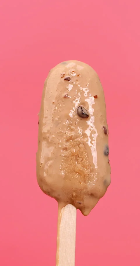 Melting bubble tea popsicle on pink background. Stock Footage 246839371