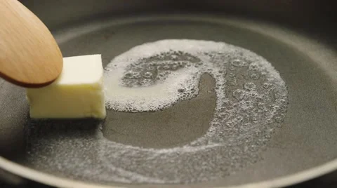 Melting butter in hot pan Stock Footage 61797396