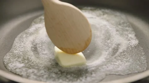 Melting butter in hot pan Stock Footage 61823133