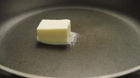 Melting butter in hot pan Stock Footage 61825054