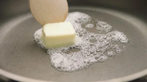 Melting butter in hot pan Stock Footage 61825531