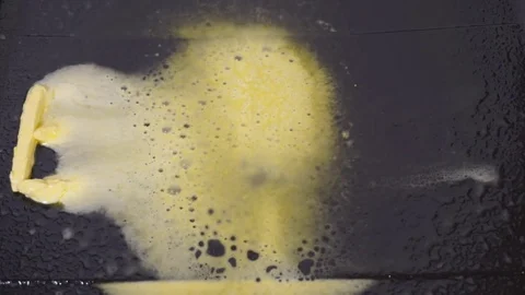 Melting butter On Hot Pan - reverse video Stock Footage 71773687