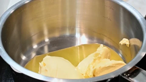 Melting butter to a liquid state Stock Footage 219878230
