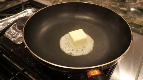 Melting butter on a pan Stock Footage 140760220