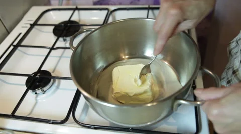 Melting butter in a pot Stock Footage 58140815