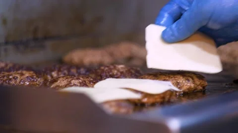 Melting Cheese On A Charbroiled Burger in slow motion Stock Footage 138607236