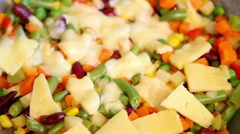Melting cheese on vegetables Stock Footage 36739400