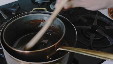 Melting chocolate on the stove Stock Footage 75759525