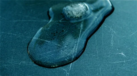 Melting Circular Ice Cube Reversed Stock Footage 611037