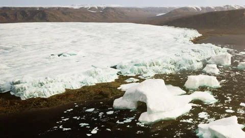 Melting glacier edges in a remote Arctic landscape near a water body Stock Footage 342814839