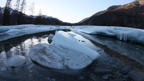 Melting glacier on the river in the spring in the mountains Stock Footage 97738270