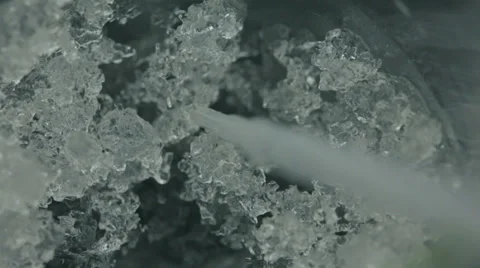 Melting ice and dropper in a beaker 3 Video stock 37987744