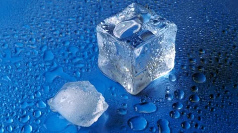 Melting ice on blue background Stock Footage 8908979