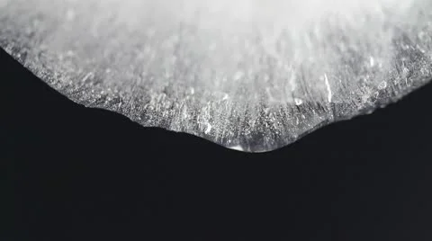 Melting ice closeup on black background Stock Footage 10575013