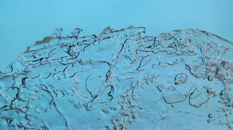 Melting ice closeup on blue background. accelerated shoot Stock Footage 10566131