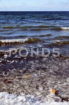 Melting ice at coast Stock Photos