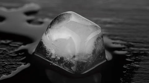 Ice Cube Melting Stock Footage ~ Royalty Free Stock Videos | Pond5