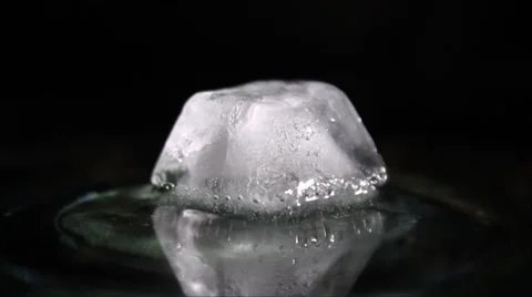 Melting ice cube in the dark Stock Footage 58300642