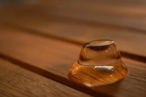 Melting ice cube on table Stock Photos