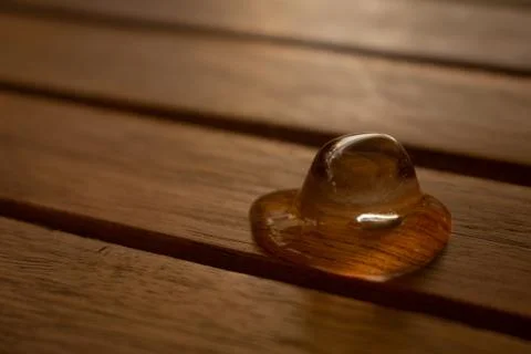 Melting ice cube on table Stock-Fotos