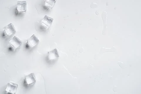 Melting ice cubes on a white background Stock Photos