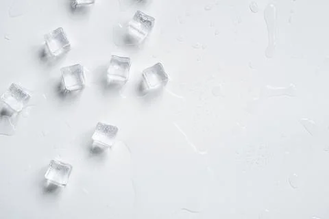 Melting ice cubes on a white background Stock Photos