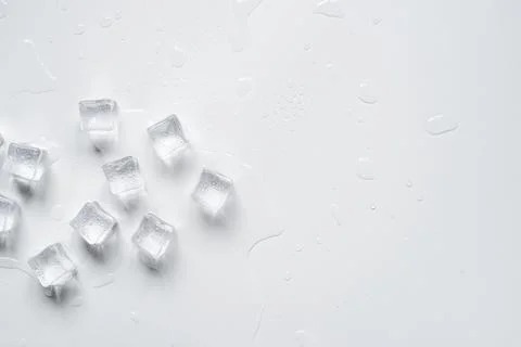 Melting ice cubes on a white background Stock Photos