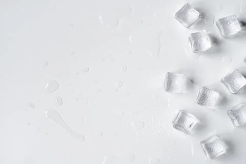 Melting ice cubes on a white background Stock Photos