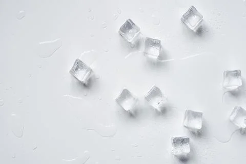 Melting ice cubes on a white background Stock Photos