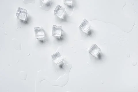 Melting ice cubes on a white background Stock Photos