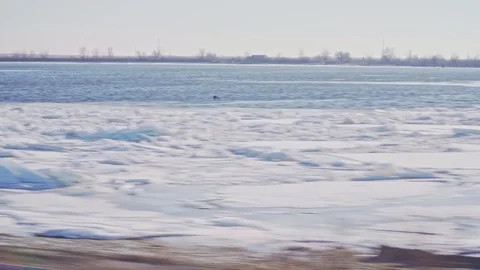 Melting ice floating on the river Stock Footage 102345122