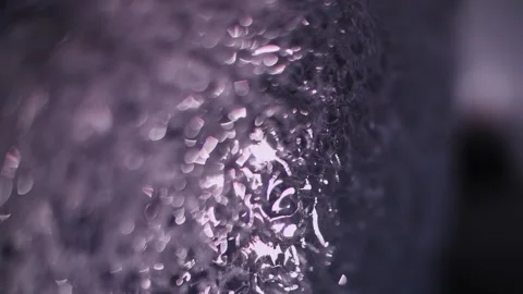 Melting ice with light reflections in Iceland Macro shot Stock Footage 306525424
