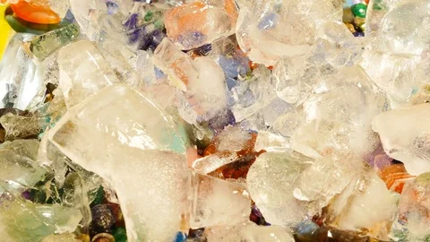 Melting ice opening view to a treasure with precious stones Stock Footage 76166120
