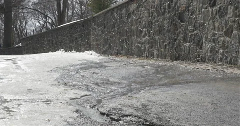 Melting ice on road -  4K Stock Footage 48819647
