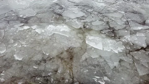 Melting ice on springtime lake shore, Finland Stock Footage 153075287
