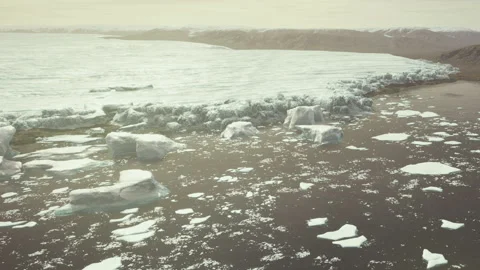 Melting icebergs float near the shore in a remote Arctic location Stock Footage 340624255
