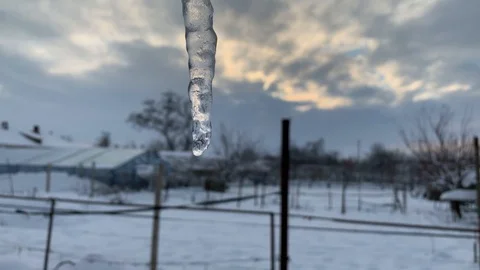 Melting icicle against the sky Stock Footage 101023081