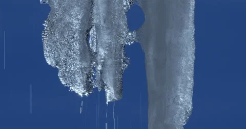 Melting icicles isolated against blue sky Stock Footage 264808623