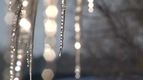 Melting icicles sparkle in the sunlight - Closeup Stock-Footage 47726644