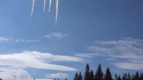 Melting icicles in spring winter against blue sky and trees Video stock 87910895