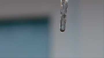 Melting icicles on sun. Loop Stock Footage 86128391