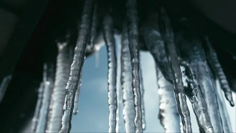 Melting icicles on sun. Slow motion Stock Footage 86128602
